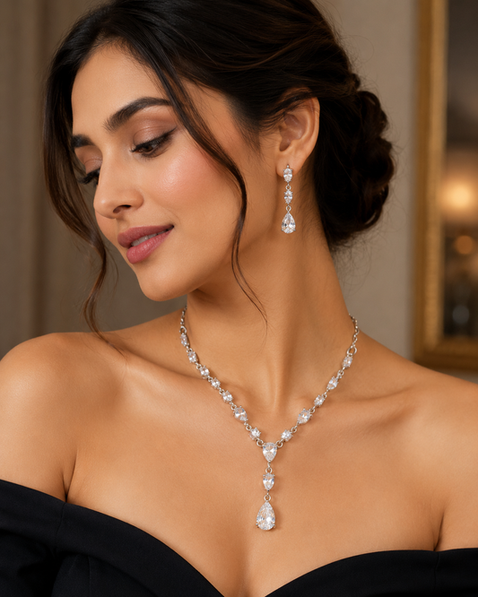 Luxury American Diamond necklace set with matching teardrop earrings for women, featuring sparkling CZ stones by The Mirage Fashion.