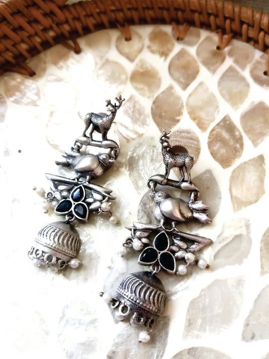 Mirage  -Antique Silver Animal Motif Jhumka Earrings with Magenta Stone Accents