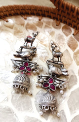 Mirage  -Antique Silver Animal Motif Jhumka Earrings with Magenta Stone Accents