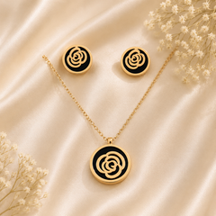 Anti tarnish rose gold floral pendant necklace with black enamel detailing and matching stud earrings for women, elegant designer jewellery set.