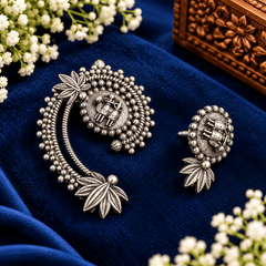 Antique silver-tone elephant motif earrings with beaded detailing and sculpted leaf accents
