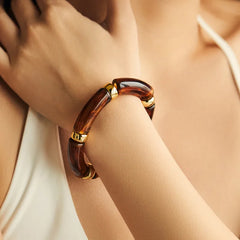 Brown tortoiseshell open kada for women with gold-tone accents