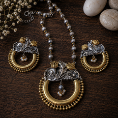 Dual tone gold and silver floral statement pendant set with matching earrings and beaded necklace for ethnic and festive wear by The Mirage Fashion