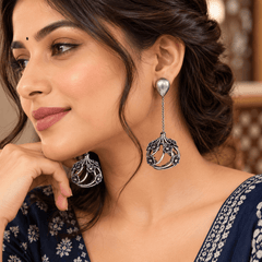 Antique silver-tone floral drop earrings with chain links and an openwork flower frame