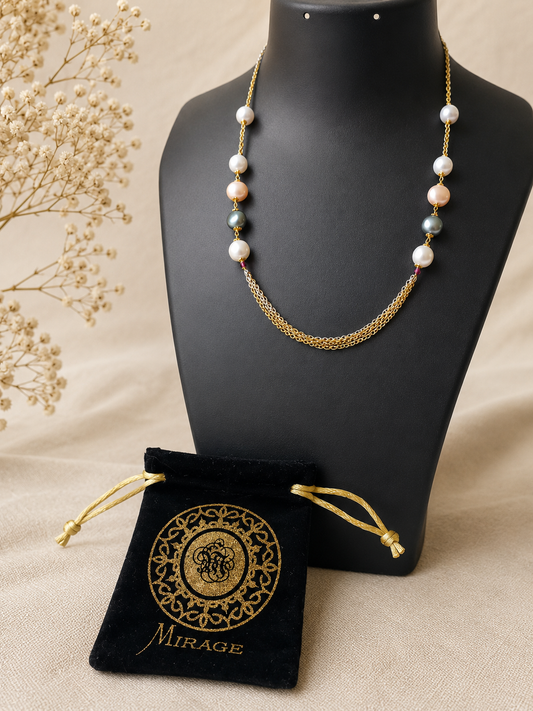 Elegant multi pearl layered necklace with dual-tone chains and white, champagne, and grey pearls for women by The Mirage Fashion.