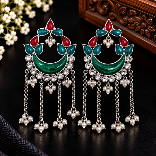 Emerald green crescent chandelier earrings with red and teal accents, clear stones and pearl-style hanging chains
