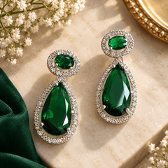 Emerald green teardrop gemstone necklace with silver-tone crystal detailing and matching drop earrings
