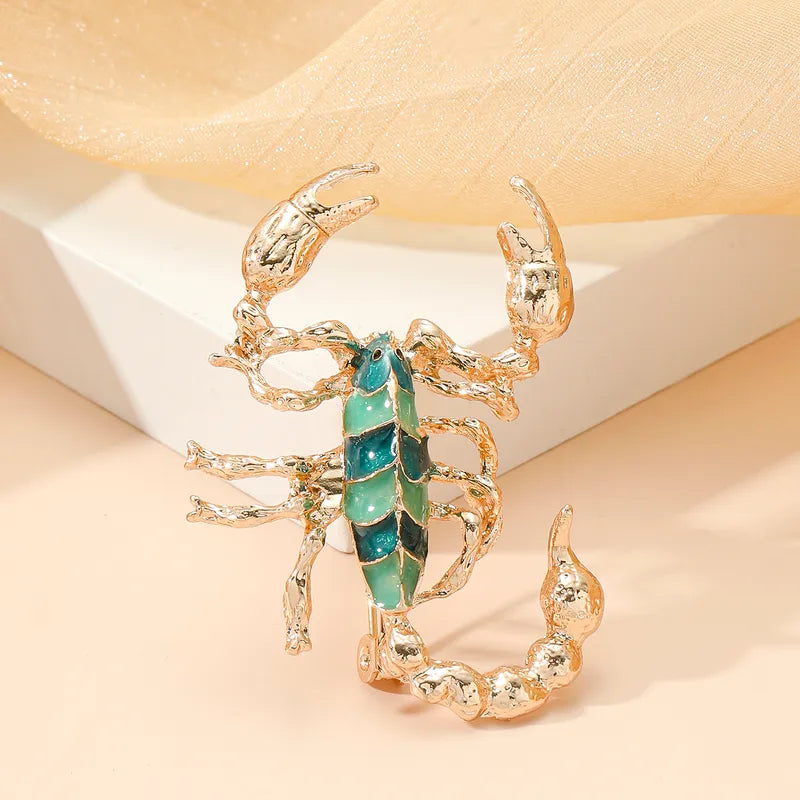 Mirage -Bold Scorpion Brooch in Gold with Teal Enamel – Unique Zodiac-Inspired Statement Pin for Women