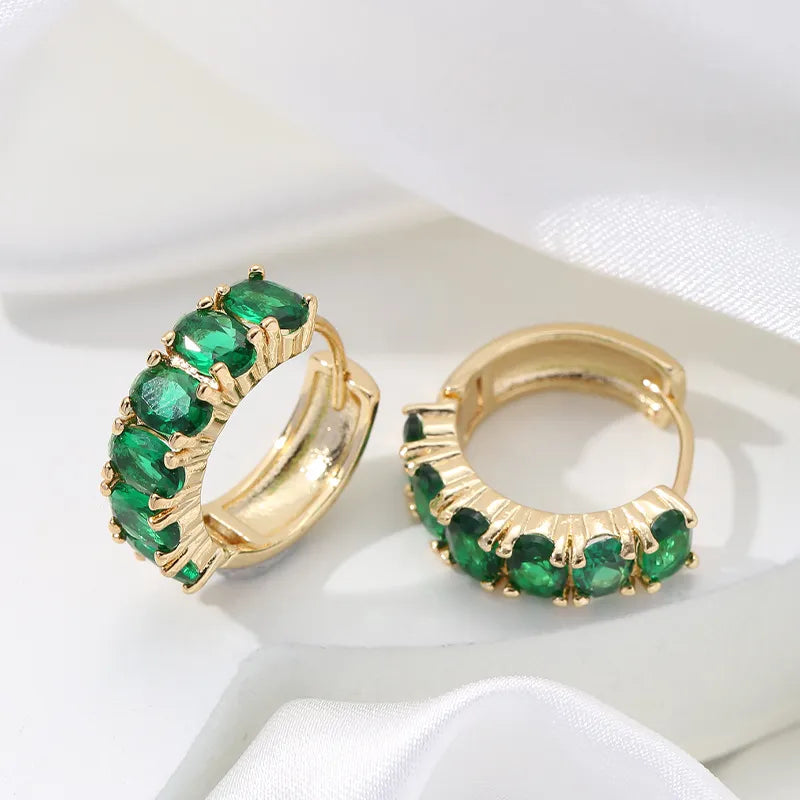 Mirage  Golden hoop earing with colored crystal