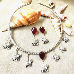 Mirage - Stylish Hasli necklace  on Red stone and hanging elephant design and a beautiful marching earrings