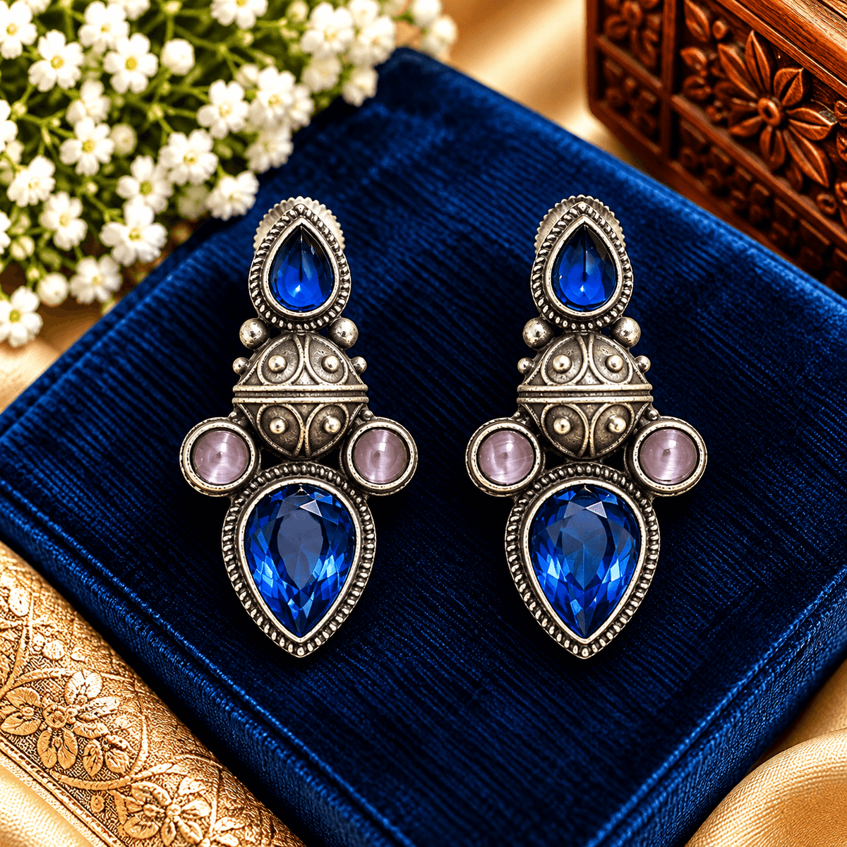 Royal blue teardrop oxidized statement earrings with pink accent stones by The Mirage Fashion