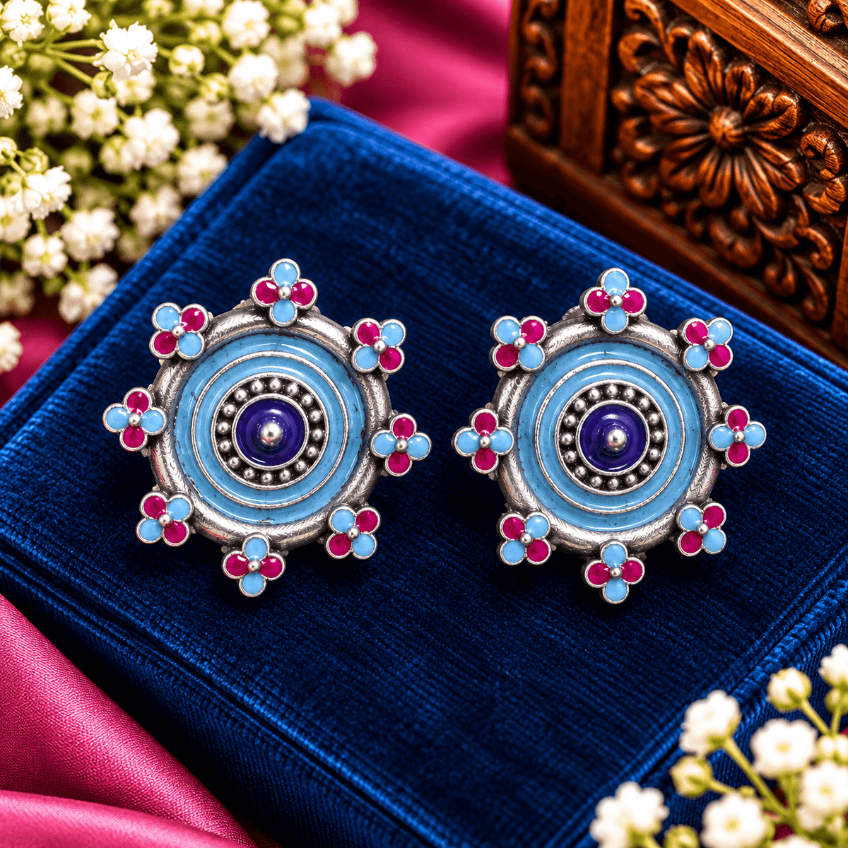 Blue and magenta Meenakari-style oxidized statement earrings with circular detailing and floral accent