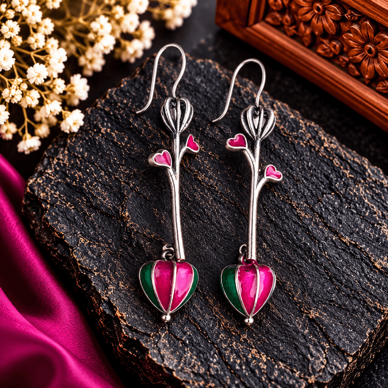 Pink and green heart-shaped dangle earrings with silver-tone stems and small pink heart accents