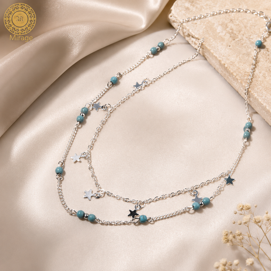 Silver two layer chain necklace with star charms and turquoise beads for women.