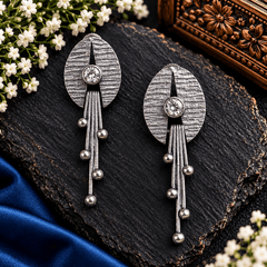 Moonlit Charm textured silver-tone dangle earrings with clear stone accents and elongated drops