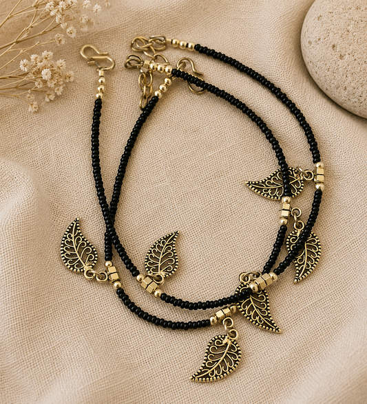 The Mirage Fashion Black Beaded Leaf Charm Anklet – Dual Layer Boho Gold-Tone Payal for Women