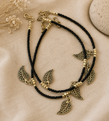 The Mirage Fashion Black Beaded Leaf Charm Anklet – Dual Layer Boho Gold-Tone Payal for Women