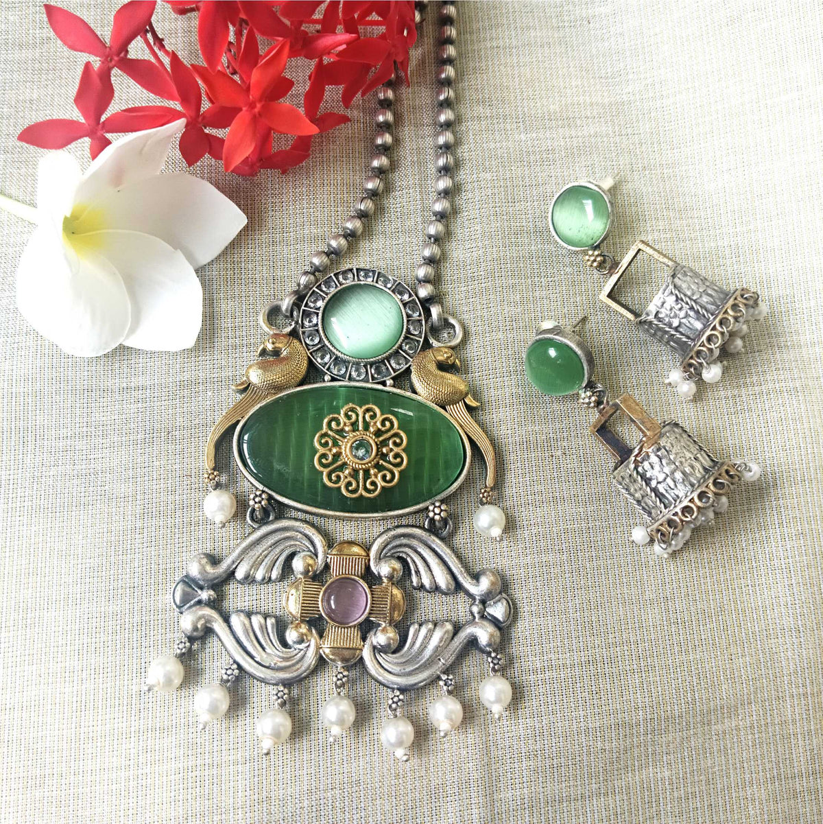 Mirage -  Super stylish Golden and Silver dual tone Oxidize  necklace with green Monalisa stone and big jumki earrings