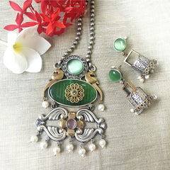 Mirage -  Super stylish Golden and Silver dual tone Oxidize  necklace with green Monalisa stone and big jumki earrings