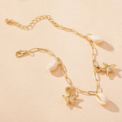 Mirage - Blue enamel  Starfish and shell  golden anklets .