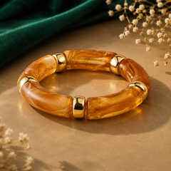 Amber brown chunky bangle for women with gold-tone accents