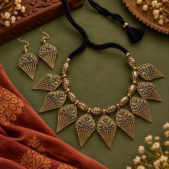 Antique gold tribal necklace set with engraved triangular charms and matching earrings for women