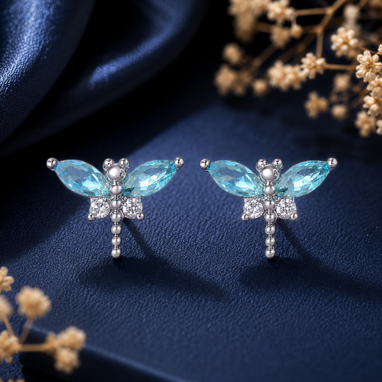 Blue butterfly crystal stud earrings with silver-tone detailing for women