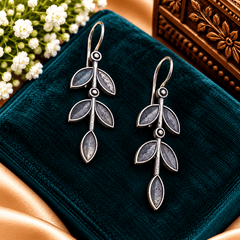 Oxidized silver-tone drop earrings featuring an elongated botanical vine and leaf design