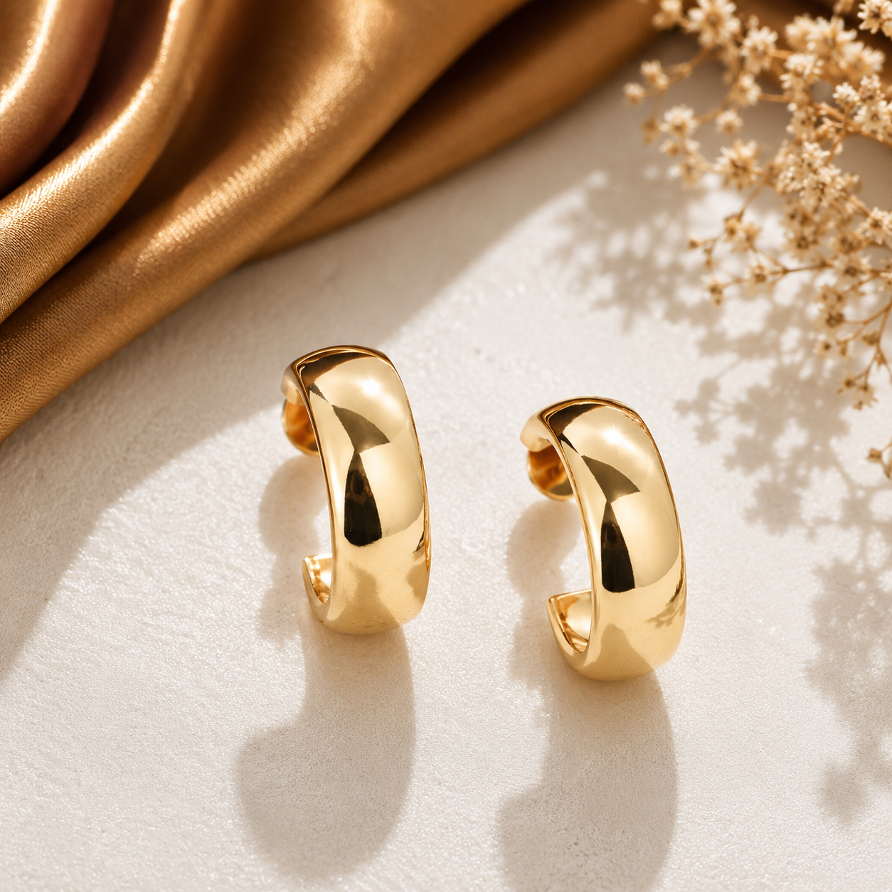 Stylish chunky open hoop earrings with polished metallic finish