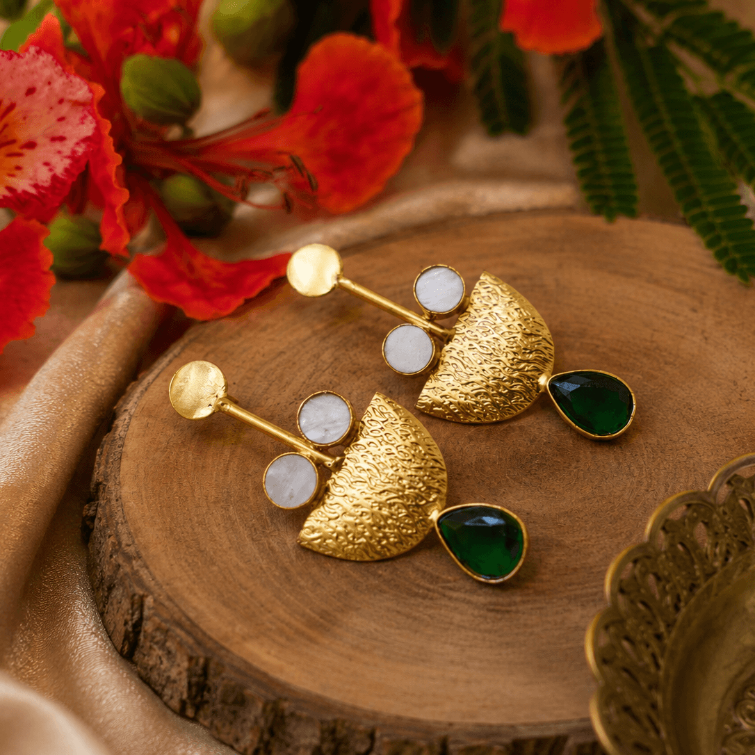 Textured gold-tone drop earrings with deep green teardrop stones and white circular accents by The Mirage Fashion