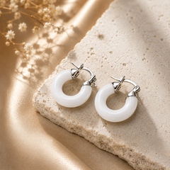 Glossy white C hoop earrings for women with silver-tone detailing