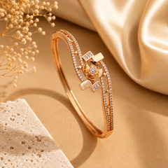 Gold AD designer kada for women with floral motif and sparkling stones