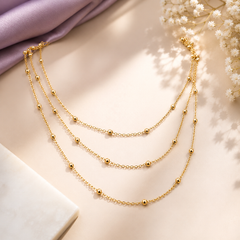 Gold layered chain necklace with delicate beaded details for women
