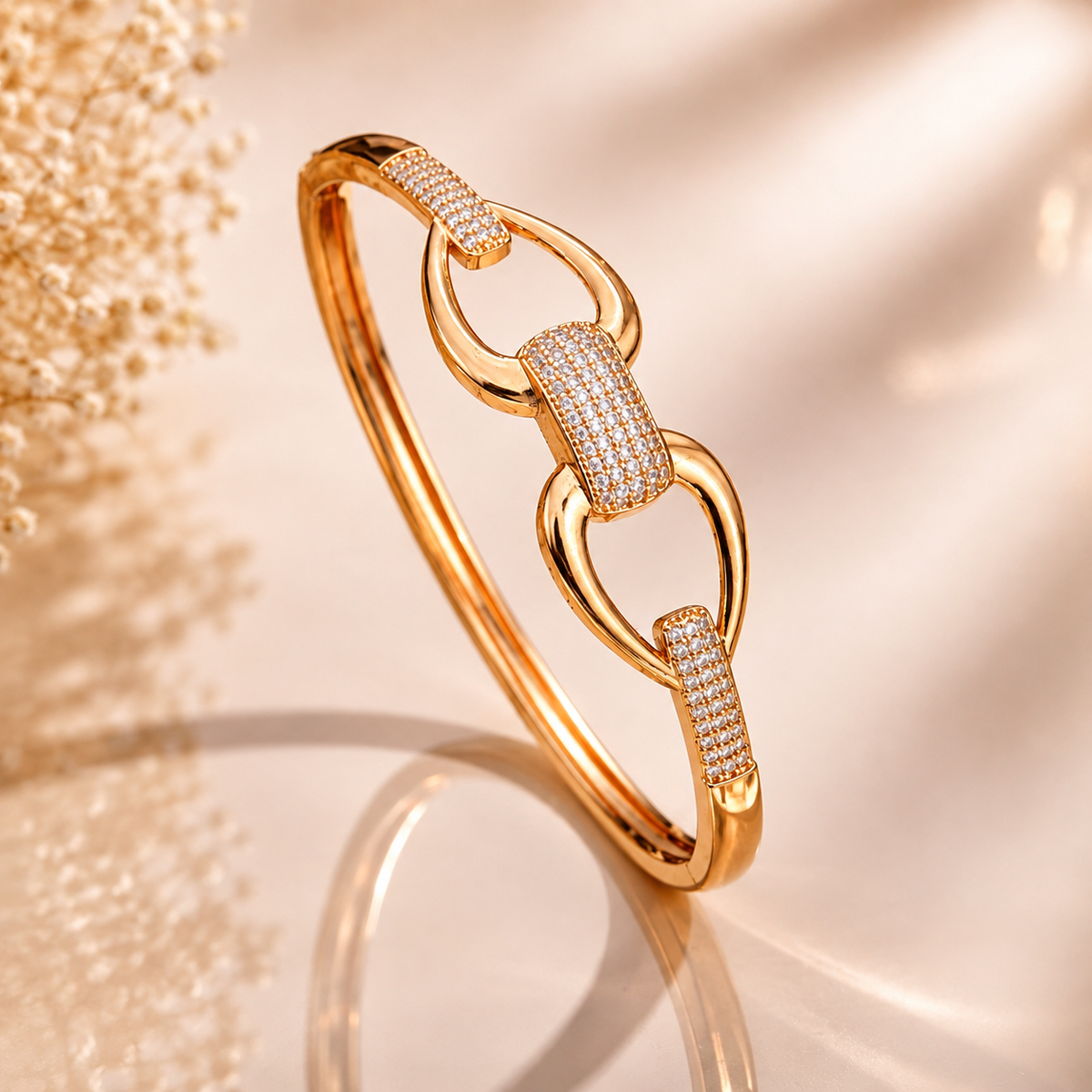 Gold-tone crystal link kada for women with sparkling detailing