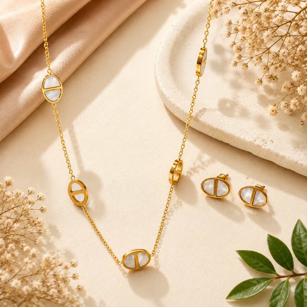 Gold-tone oval Mother of Pearl necklace and matching stud earrings with white inlay detailing