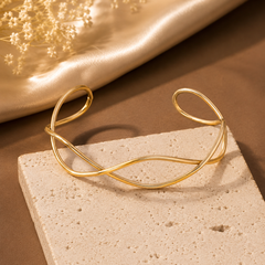 Minimalist gold-tone open cuff kada for women with curved design