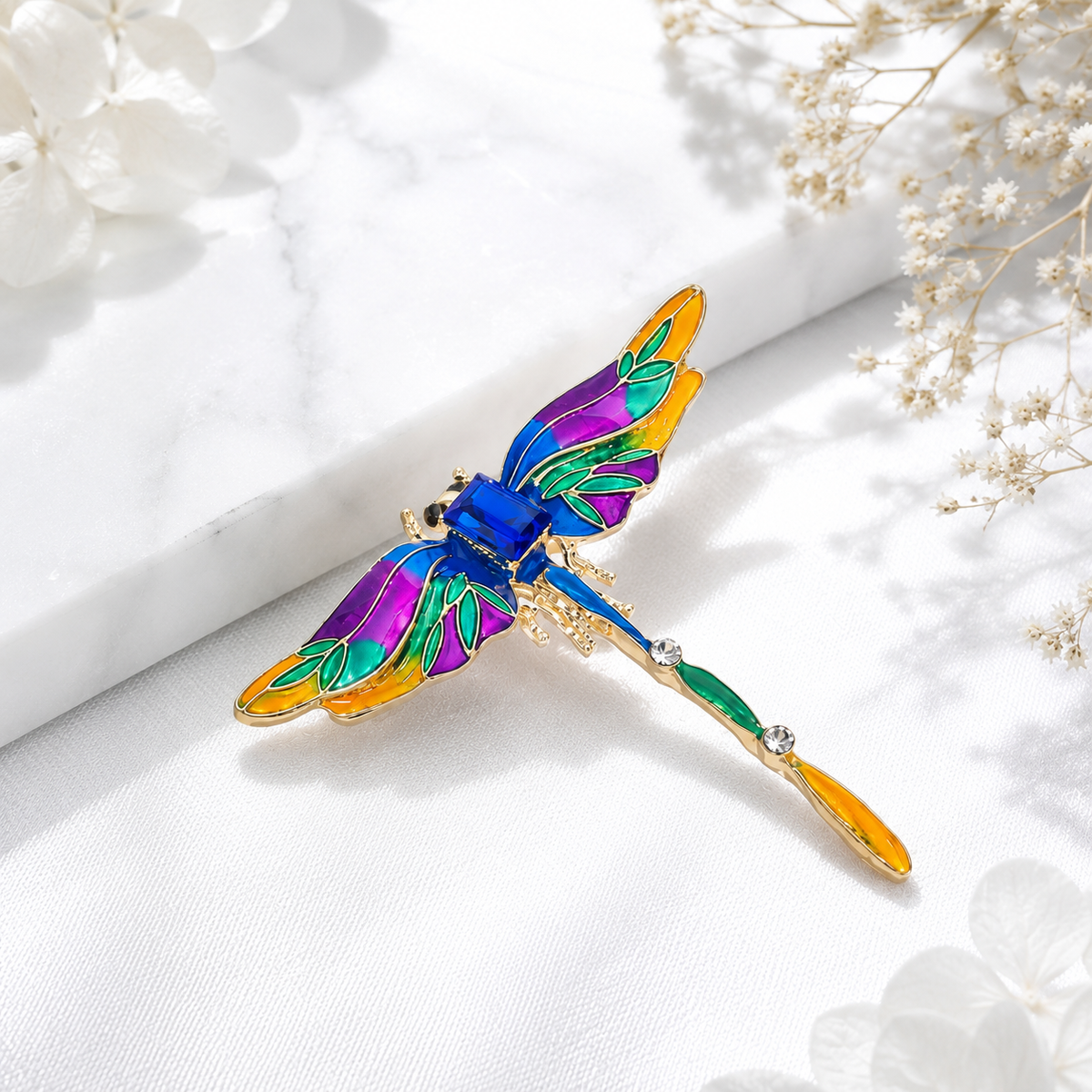 Multicolor dragonfly brooch with blue, purple, green and orange detailing