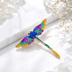 Multicolor dragonfly brooch with blue, purple, green and orange detailing