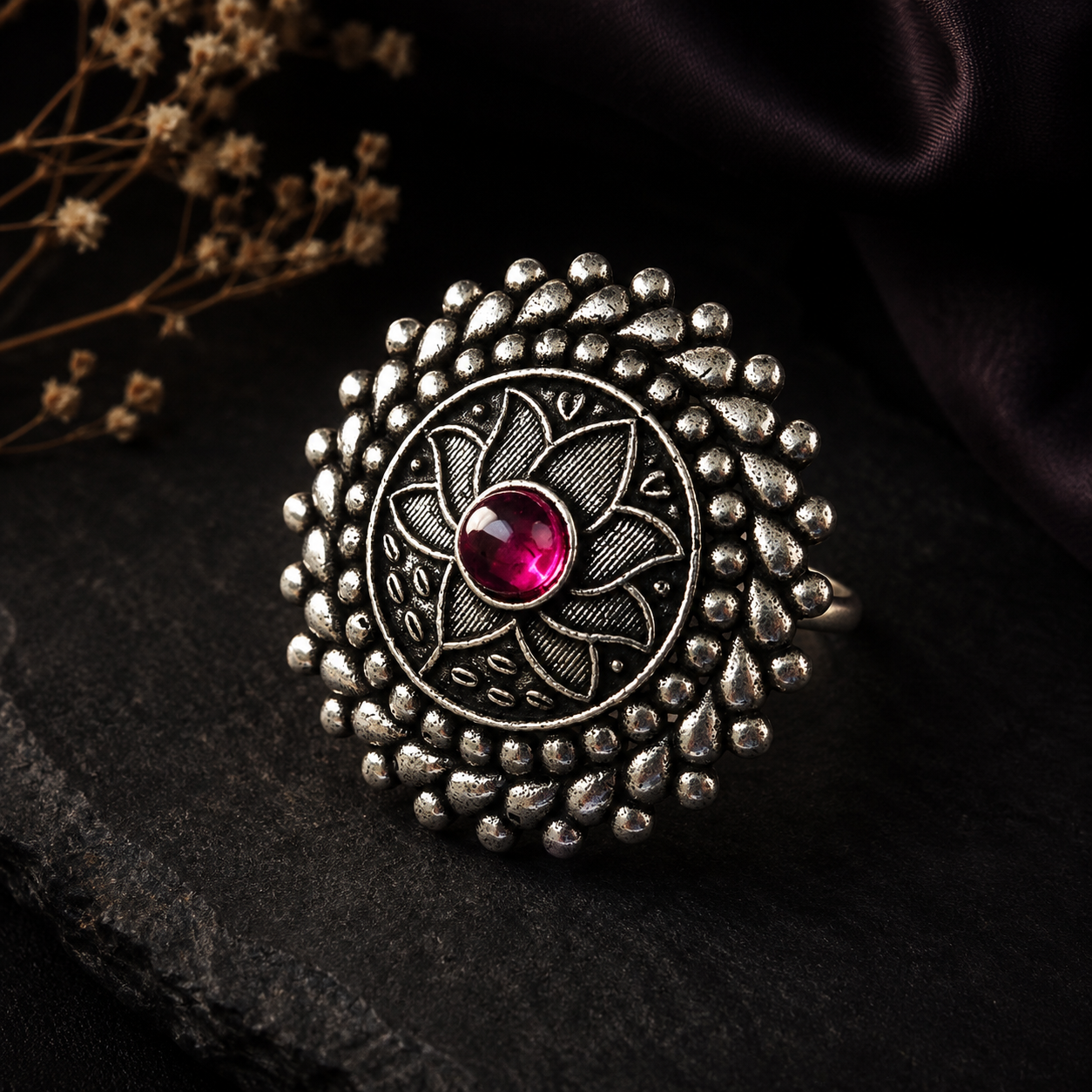 Oxidised silver floral statement ring for women with pink centre stone and intricate detailing