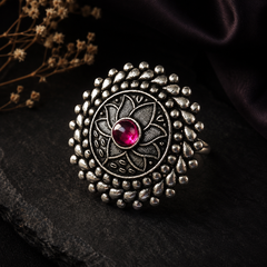 Oxidised silver floral statement ring for women with pink centre stone and intricate detailing