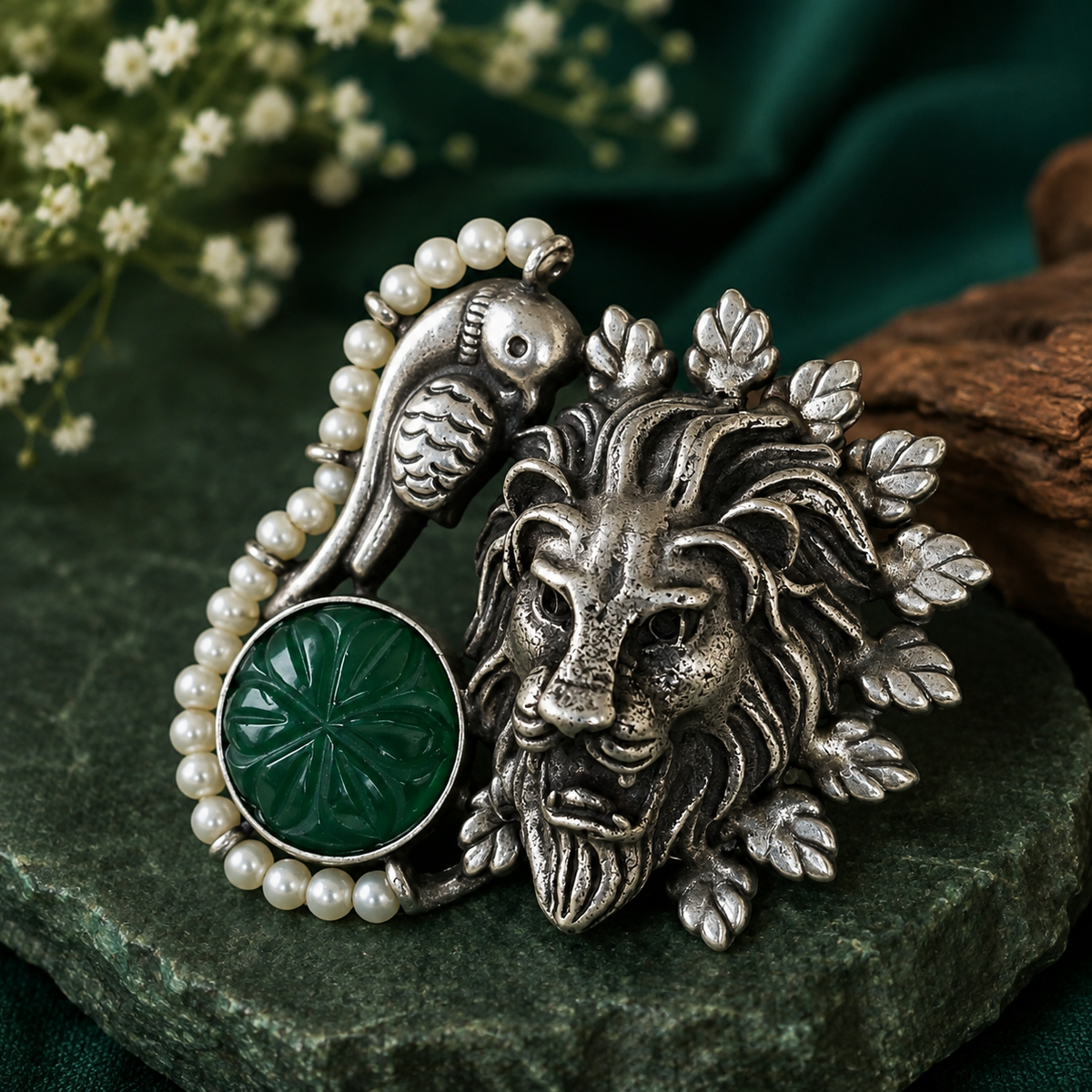 Oxidised silver lion statement ring with green stone and pearl detailing