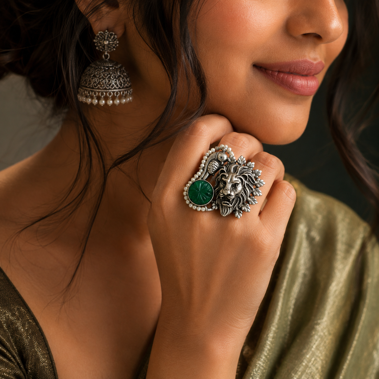 Oxidised silver lion statement ring with green stone and pearl detailing