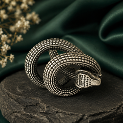 A silver-toned snake coiled in a knot Ring
