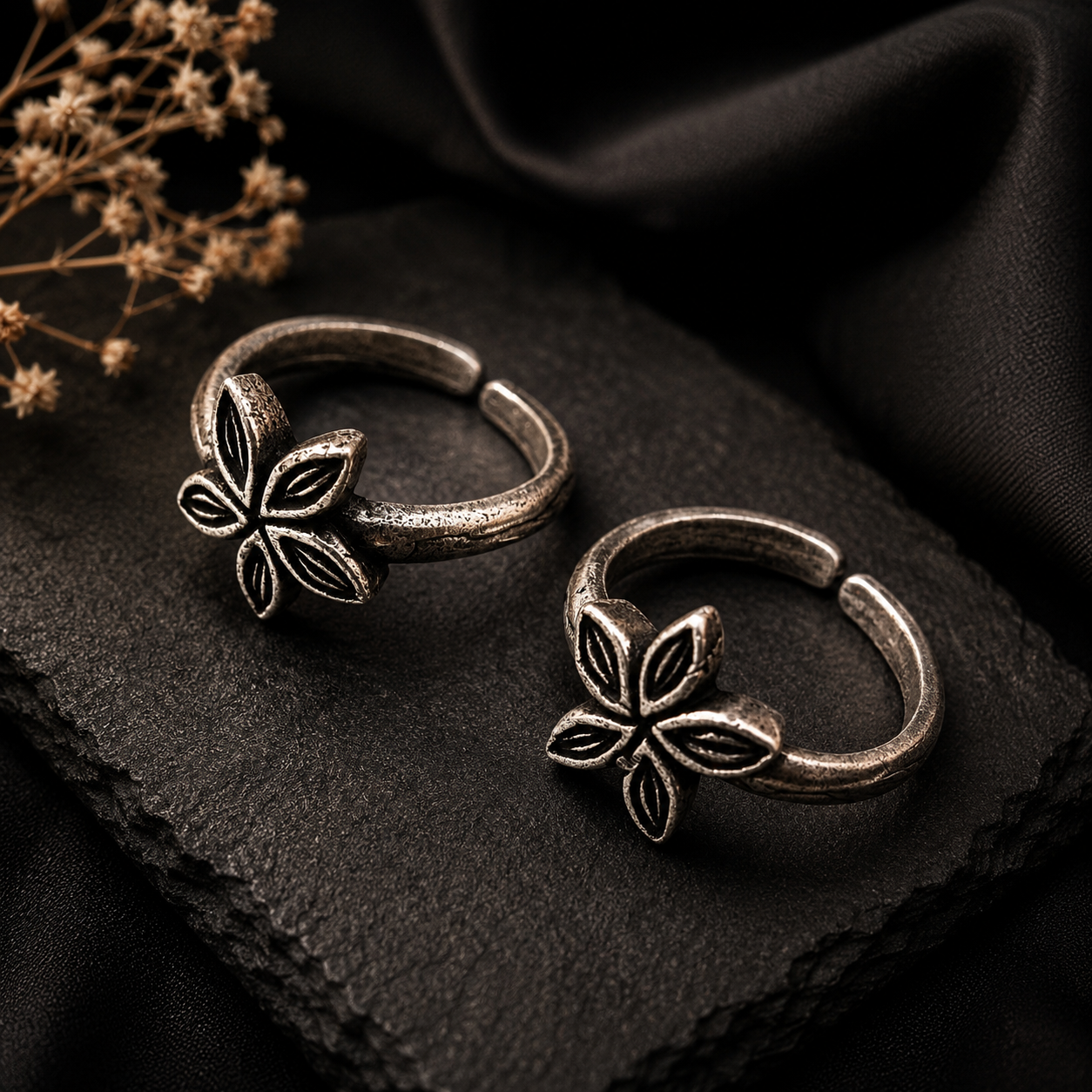 Oxidized silver floral toe rings for women with intricate flower design