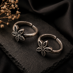 Oxidized silver floral toe rings for women with intricate flower design