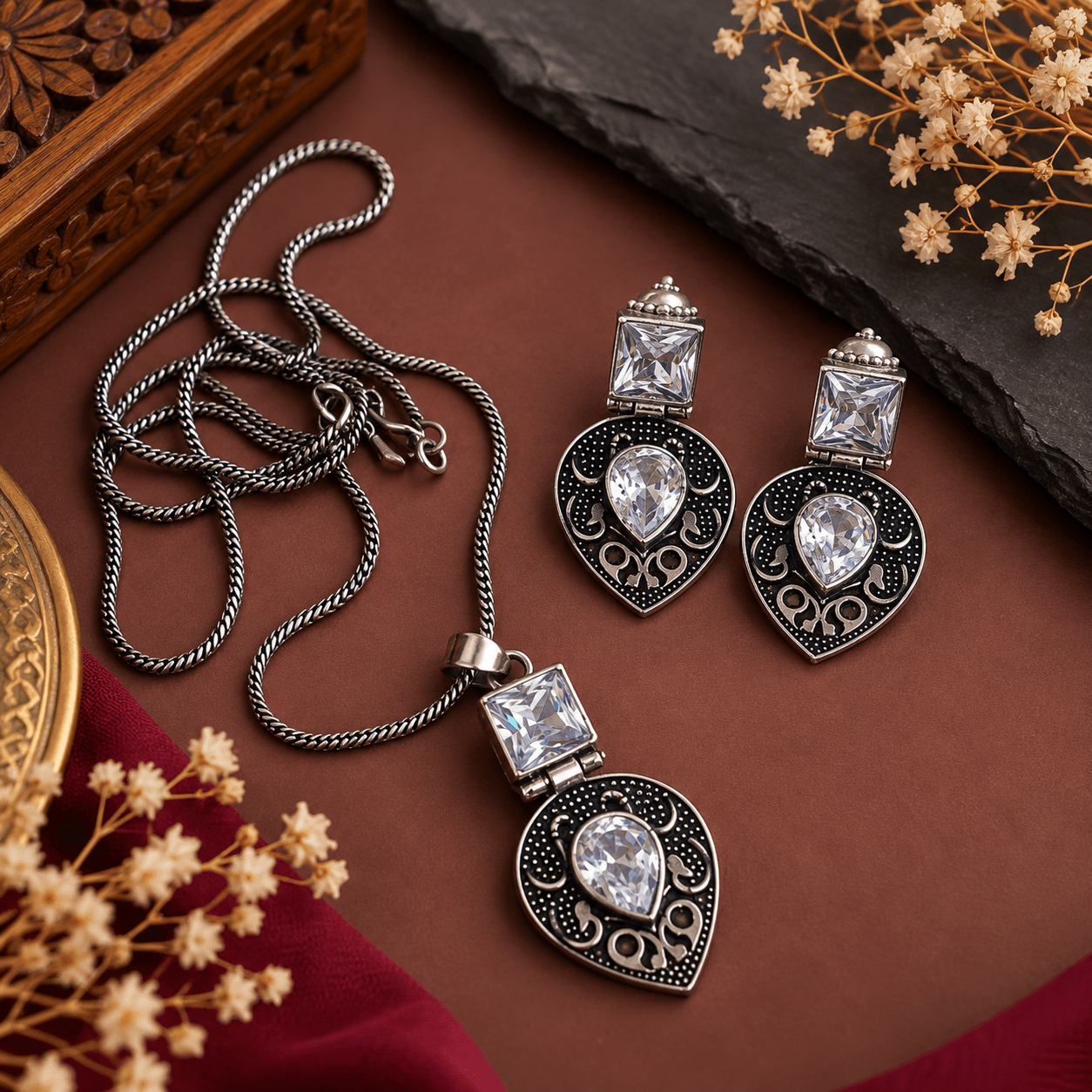 Oxidized silver teardrop pendant necklace with clear stones and matching statement earrings