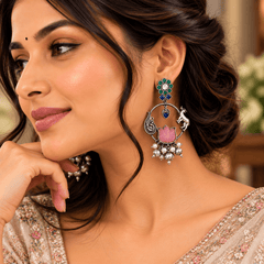 Pink lotus stone-work oxidized earrings with green and blue stones, peacock-inspired silver detailing and dangling beads