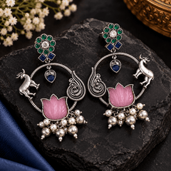 Pink lotus stone-work oxidized earrings with green and blue stones, peacock-inspired silver detailing and dangling beads