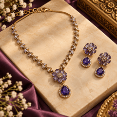 Purple floral crystal necklace with teardrop pendant and matching earrings in Mehendi finish