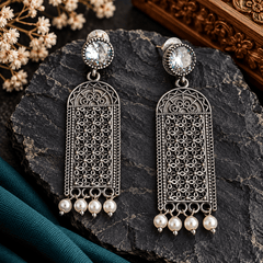 Long oxidized silver-tone filigree earrings with clear round stones and white pearl drops